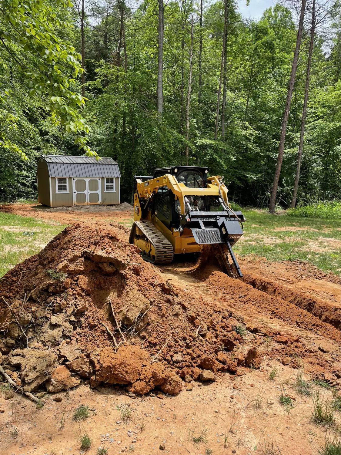 Laying the drainage pipe for rain water on the for the car parking lot is covered gravel driveway