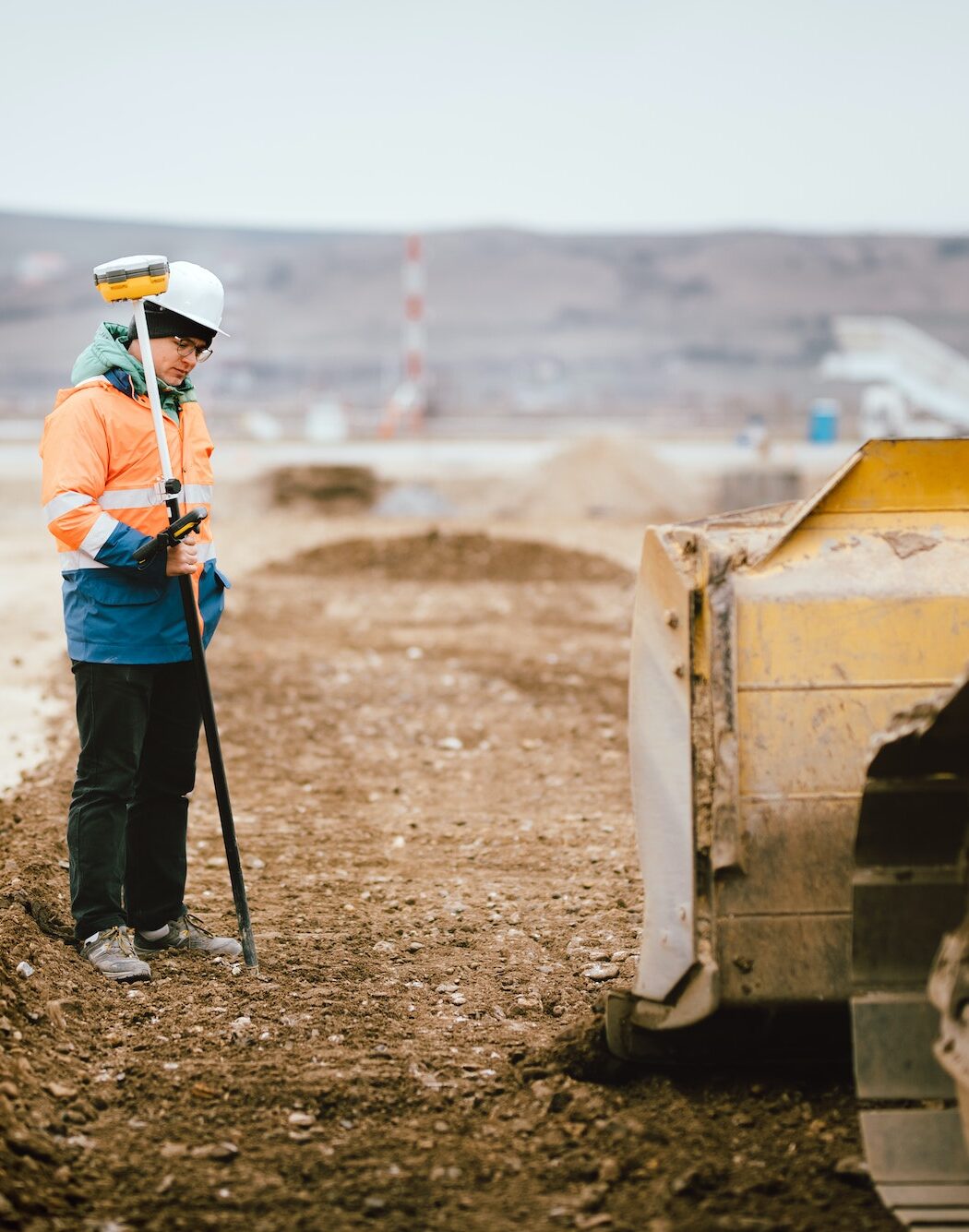 Geodesy details - construction site workers building highway and roads. Surveying engineer details